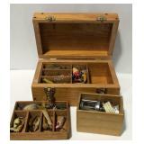 Wooden tackle box with fishing lures and reel