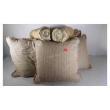 Five throw pillows and two neck roll pillows,