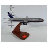 United Airlines model airplane on nice wooden