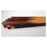 Eight pool cues, wood and fiberglass
