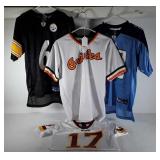 Four youth size jerseys, sizes M and L, Redskins,