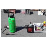 Oil disposal jug, chemicals, sprayer, weed tool