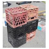 2 stacks of plastic dairy crates