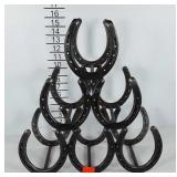 Cowboy metal art, horseshoes to form a wine