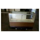 Floor model display case with lights and outlet