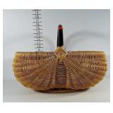 Large woven buttox basket with black wooden