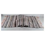 Woven rag rug in nice condition. 65 × 26"