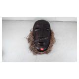 Wooden tribal mask wall hanging, has slight