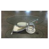 Modern, glass top coffee table. Damaged feet.