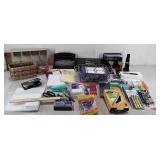 Office supplies. Small sentrysafe, pens,