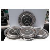 Four mercedes hubcaps, needs cleaned, have some