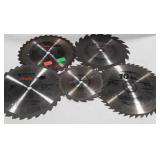 Five circular saw blades, four 10", one 7".