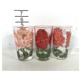 Three peanut butter jar glasses, rose, petunia