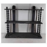 Homemade three tiered hanging wooden shelf, shows