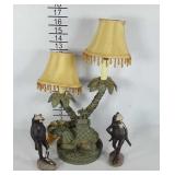 Elephant accent lamp and two frog statues