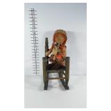 Cloth doll with tattered dress in rustic doll