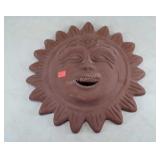 Large red ceramic sun plaque. 18" diameter.