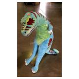 Colorful stuffed tyranosaurus rex. 43" high.