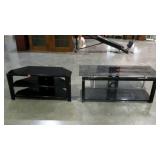 Two glass and tubular steel framed TV stands with
