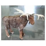 Stuffed moose with posable antlers. 40" long, 30"