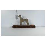 Poodle dog boot scraper on wood base. Note: