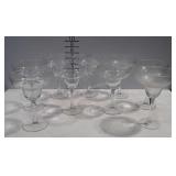 9 clear margarita glasses, one marked