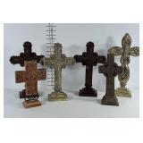 6 cross statues. Heights range betweem 9 & 14