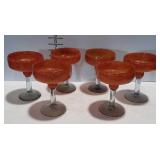 Set of six decorative margarita glasses.