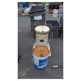 Kerosene heater and a partial bucket of kerosene