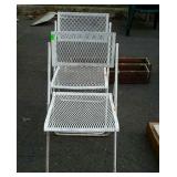 Two white folding  chairs