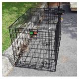 Petco metal dog kennel measures 23 in wide by 36