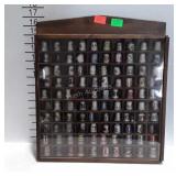 Thimble collection with wooden display case.