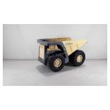 Tonka dump truck with metal grille and bucket,