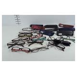 Reading glasses and glasses cases. Many are
