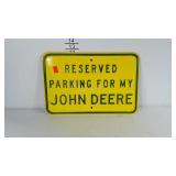 Heavy metal reserved parking John Deere sign.