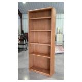 Tall bookcase, oak finish, adjustable shelves.