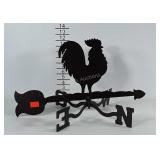 Metal weather vane decor piece.