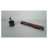 Small 12 inch wooden level and old oil can.