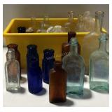 Glass bottles in yellow container