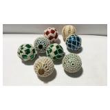Eight Christmas bulbs with crochet design