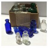 Assorted medicine bottles some colored and clear