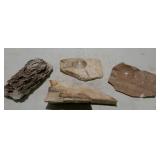 Four rock and stone specimens.