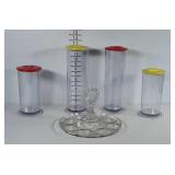 4 poly canisters with red and yellow lids plus a