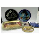 Assorted tin trays, some are bicentennial.