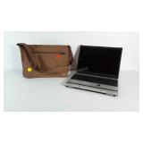 Toshiba laptop. Powers on. Has cord. Has WINDOWS