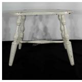 Wooden vanity stool with kidney shaped seat.