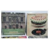 Twelve ROLLING STONES albums with covers.