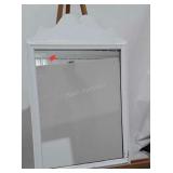 Mirror in wooden frame. Measures 20"x32" with