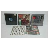 Five record albums. Four Quiet Riot and one