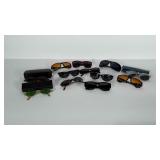 12 pairs of sunglasses, different shapes, styles